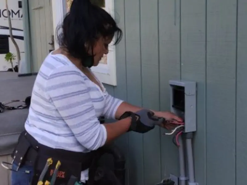 Licensed electrician wiring an exterior subpanel in Kelseyville